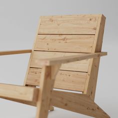 a wooden chair sitting on top of a white floor