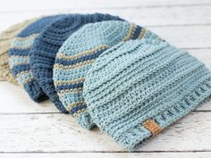 three knitted hats sitting on top of each other