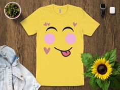 Express with Emoji: Yellow Shirt Collection 😀 Elevate your wardrobe with our emoji-inspired yellow shirts, adding a dash of fun and expression to your style. Why Choose Our Emoji Yellow Shirts? ✨ Support a Small Business: Your purchase directly supports our creative journey, helping us bring more cheerful designs to life. 😃 Express Yourself: Wear the iconic emoji face proudly and let your emotions shine through your fashion. 🌟 Premium Quality: Crafted with care, our shirts offer comfort and vibrant style, perfect for a pop of color. 🎁 Perfect Gift: Share the joy of expression with a friend, and gift them a shirt that's as bright as their smile. Join us in celebrating the art of expression. Shop now and add a touch of cheerfulness to your attire! 𝐏𝐑𝐎𝐂𝐄𝐒𝐒𝐈𝐍𝐆 𝐓𝐈𝐌𝐄 𝗔𝗡𝗗 𝐒? Yellow Crew Neck Top With Funny Text, Fun Smiley Face Tops, Yellow Funny Print T-shirt, Funny Yellow Crew Neck Top, Playful Yellow Top With Funny Print, Yellow T-shirt With Funny Print, Yellow Casual Tops With Funny Text, Trendy Yellow Shirt With Funny Print, Yellow Casual Top With Funny Text