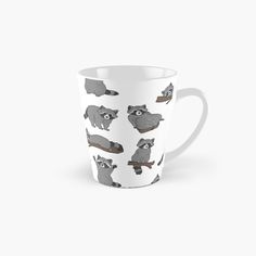 a tall mug with raccoons on it