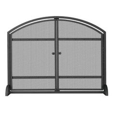 an iron fireplace screen with two doors