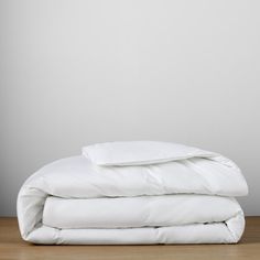 two white pillows stacked on top of each other