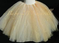 Gold Sparkle Birthday Tutu Skirt Cake Smash Tulle Skirt Gold Skirt Wedding Dress Skirt Gold Tutu Womens Tutu This gold sparkle skirt was a custom order and client was kind enough to share her photos! Made with almost 500 yards of tulle this skirt is hand tied on ribbon. Please note there are knots at the waistband and the ribbon simply ties and unties for easy dressing. More than one color of tulle does result in multi colored knots. The colors blend most when tutu is fluffed . This tutu is a bl Gold Tulle Skirt, Tulle Clothes, Wedding Dress Skirt, Skirt Wedding Dress, Sparkle Birthday, Gold Tutu, Gold Tulle, Sparkle Skirt, Gold Skirt