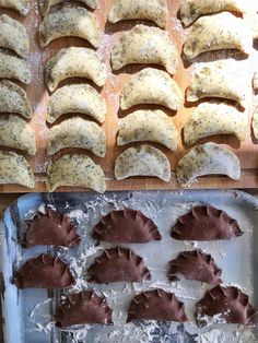 several different types of pastries on trays next to baking sheet with utensils