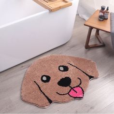 a bathroom rug with a dog's face drawn on the floor next to a bathtub