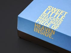 a blue box with the words sweet little deli gloous and made of heaven inside