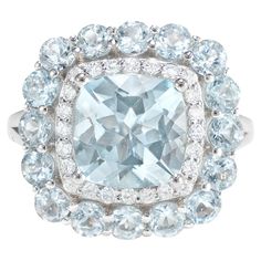 This collection features an array of aquamarines with an icy blue hue that is as cool as it gets! Accented with diamonds these rings are made in white gold and present a classic yet elegant look. Classic aquamarine ring in 18K white gold with diamonds. Aquamarine: 2.56 carat cushion shape, 9X9mm. Aquamarine: 1.72 carat round shape, 3X3mm. Diamonds: 0.28 carat, G colour, VS clarity. Gold: 5.178g, 18K white gold. Ring Size: US 6.75 - Size can be adjusted for free upon request - please reconfirm wi 5 Carat Ring, Contemporary Engagement Rings, Morganite Ring, Naha, Modern Ring, Icy Blue, Aquamarine Rings, Diamond Stone, Bridal Rings