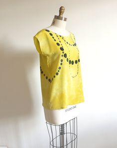 "silk blouse, hand painted. silk in hand dyed lemony yellow. hand painted black or charcoal grey dots. this is made to order piece, and each one is unique. matte texture, medium weight silk used. drapes beautifully and feels great on bare skin. silk dyes are permanently set by slow steam setting. Hand washable, yay! SIZES: Available in all sizes. You can customize the size to your specification. When purchasing, please indicate numeric size on \"note to seller\". Or provide me with your height, Hand Painted Blouse, Painted Blouse, Shibori Dress, Texture Medium, Matte Texture, Painted Silk, Bare Skin, Hand Painted Silk, Silk Dyeing