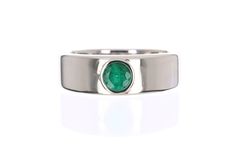 A masculine, modern men's ring made in 14K white gold. This ring is made with the finest, genuine materials from our emerald collection. The round emerald is natural and bezel set in smooth white gold. This ring is comfortable to wear daily. Setting Style: Bezel Setting Weight: 10 Grams 14K Setting Material: 14K White Main Stone: Emerald Grade Quality: AA+ Shape: Round Cut Stone Measurements: 5.3 mm Weight: approx 0.70 pts Cut: Good Clarity: Translucent Hue: Medium Dark Color: Green Luster: Exce Modern Round Emerald Ring For Formal Occasions, Modern Emerald Ring With Bezel Setting For Formal Events, Modern Emerald Ring With Bezel Setting For Formal Occasions, Modern Formal Emerald Ring With Bezel Setting, Formal Modern Emerald Ring With Bezel Setting, Modern Platinum Signet Ring For Gift, Modern Platinum Signet Ring As Gift, Modern Polished Emerald Ring For Anniversary, Modern Emerald Ring With Tension Setting