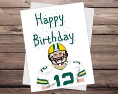 a card with a drawing of a football player wearing a helmet and number twelve on it