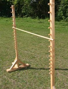 a pair of wooden racks in the grass