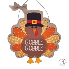 a turkey shaped ornament with the words gobble gobble on it