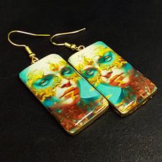 These image transfer earrings are ready to ship.  The earrings are handcrafted from polymer clay and uses my own image transfer technique. They have a top layer of resin.  I have only one pair of these earrings. Artistic White Resin Earrings, Artsy White Resin Earrings, Unique Hand Painted Earrings For Gift, Handmade Artsy Resin Earrings, Hand Painted Resin Earrings For Gifts, Hand Painted Resin Earrings As Gift, Artistic Hand Painted Polymer Clay Earrings, Artsy Nickel-free Polymer Clay Earrings, Artistic Resin Earrings With Ear Wire