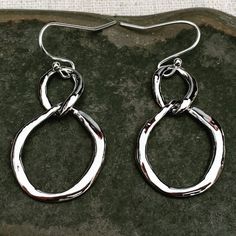 These are stylish and timeless dangle drop earrings.  Simple and refined.  Versatile and perfect for everyday wear.  Dress them up or down.  They would complete any look.The earrings measure 1 1/8” long by 3/4” wide.  They hang from simple silver ear wire hooks.  Overall drop length is 1 1/4”.Thanks for stopping by!  Please take a moment and visit the rest of my Etsy shop.  I have many more unique jewelry designs to choose from!🌸 Tiger Flower Jewelry 🌸  🌸 Inspired by Nature 🌸 Elegant Hypoallergenic Infinity Earrings, Modern Twist Nickel-free Drop Earrings, Minimalist Cadmium-free Dangle Earrings, Modern Hypoallergenic Metal Teardrop Earrings, Modern Metal Hypoallergenic Teardrop Earrings, Nickel-free Dangle Earrings With A Modern Twist, Modern Twist Teardrop Earrings Gift, Nickel-free Modern Twist Dangle Earrings, Teardrop Earrings With A Modern Twist As A Gift