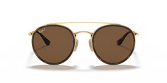 Elevate your style quotient with Ray-Ban Round Double Bridge sunglasses. These round-shaped glasses feature a polished gold metal frame that exudes elegance and sophistication, and the classic B-15 polarized lenses in brown color not only enhance your vision but also ensure superior glare protection. Featuring a black frame color, these shades are a versatile choice for any fashion-forward individual. Choose Ray-Ban Round Double Bridge to make a bold yet timeless statement. Available with prescr Modern Gold Round Frame Sunglasses, Classic Aviator Sunglasses With Metal Frame, Trendy Gold Aviator Sunglasses For Formal Occasions, Casual Gold Sunglasses With Gradient Lenses, Double Bridge Sunglasses, Round Ray Bans, New Wayfarer, Sunglass Hut, Color Dorado