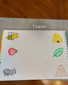 an open notebook with pictures of animals and bees