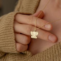 "* Material: High Quality 14K Solid Gold - Not Gold Vermeil Not Gold Plated - ( REAL SOLID GOLD ) * Metal Stamp: 14k * All our jewelry is custom made by hand with Love and Care in our workshop * 14k Solid Gold Elephant Necklace - Tiny Baby Elephant Pendant - Dainty Animal Necklace - Elephant Jewelry - Gift For Her - By Demir Uluer H O W ∙ T O ∙ O R D E R * You can choose the color of your pendant using the first box / option * You can choose the length of your chain by selecting the second option / box. * Just use the 'PERSONALIZATION BOX' to let us know the Note you want on the back of your Pendant O T H E R ∙ I N F O R M A T I O N * Material of chain: 14K Solid gold ( REAL GOLD ) It is thin and dainty and it is available in 6 sizes: - 35 cm / 13,75 inches ( Length ) - 40 cm / 15,75 inche Handmade Pendant Charm Necklaces For Birthdays, Handmade Pendant Charm Necklaces For Birthday, Handmade Pendant Charm Necklace For Birthday, Handmade Yellow Gold Necklace For Personalized Gift, Cute Handmade Necklaces For Personalized Gifts, Handmade Yellow Gold Necklaces For Birthdays, Handmade Yellow Gold Jewelry For Birthday, Cute Yellow Gold Necklace For Gift, Gold Animal Design Necklace For Gift