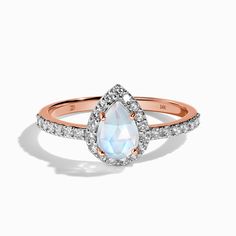 About This Ring
Cherish your love with our elegant Moonstone Ring With Diamonds - Tear of Joy, an iridescent, genuine grade AAA Moon Magic Rainbow Moonstone surrounded by a sea of 29 authentic Diamonds. The perfect piece to remember this moment, forever.    
Details
- Solid 14kt Rose Gold (weight: approx. 1.91 grams)- 29 conflict free Diamonds (weight: 0.33 Ct)  // Color: I // Clarity Rating : SI- Genuine & iridescent Rainbow Moonstone (Grade AAA)- Band Width: 1mm- Stone Size: 0.28" x 0.20" (7mm Opal Diamond Ring, Moonstone Engagement, Gem Diamonds, Moonstone Engagement Ring, Moonstone Earrings, Moon Magic, Tears Of Joy, Diamond Rings Bands, Public Speaking