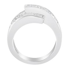 This asymmetrically designed cocktail ring will be the most unique piece you have in your jewelry collection. Crafted in the finest 14k white gold, this ring has an overlapping band that is set with beautiful princess and baguette-cut diamonds. The channel and invisible set diamonds shine in this piece that has an impressive total carat weight of 2 cttw. This is the perfect piece for any formal occasion. Modern Cubic Zirconia Rings With Channel Set, Modern Cubic Zirconia Channel Set Rings, Modern Baguette Cut Rings For Everyday Luxury, Modern Rings With Baguette Diamonds, Designer Cubic Zirconia Rings For Formal Occasions, Luxury Bypass Ring With Polished Finish, Modern Bypass Ring For Anniversary, Fine Jewelry Ring With Baguette Cut Tension Setting, Baguette Cut Ring With Tension Setting Fine Jewelry