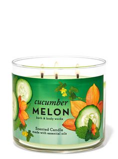 a candle with cucumber melon on it