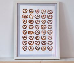 an assortment of pretzels arranged in the shape of hearts on a white background