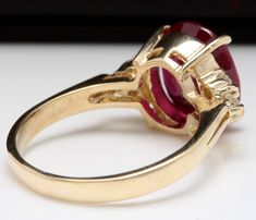 6.50 Carats Impressive Red Ruby and Diamond 14K Yellow Gold Ring Suggested Replacement Value $5,300.00 Total Red Ruby Weight is: 6.25 Carats Ruby Measures: 11x 9mm (Lead Glass Filled) Natural Round Diamonds Weight: .25 Carats (color G-H / Clarity SI1-SI2) Ring total weight: 5.2 grams Disclaimer: all weights, measurements and colors are approximate and may vary slightly from the listed dimensions or as seen in the image. All pictures are magnified to show the smallest of details. Please, refer to Formal Rings With Prong Setting For Valentine's Day, Formal Red Diamond Ring With Polished Finish, Ruby Rings For Valentine's Day Formal Occasions, Formal Ruby Rings For Valentine's Day, Classic Round Ruby Ring For Valentine's Day, Valentine's Day Formal Ruby Rings, Formal Red Ruby Ring Stamped 14k, Formal Ruby Ring For Valentine's Day With Round Cut, Valentine's Day Formal Ruby Ring With Brilliant Cut