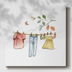 watercolor painting of clothes hanging on a clothesline with leaves and butterfly in the background