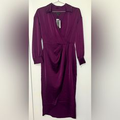 Brand New With Tags! Banana Republic Midi Dress Color: Deep Purple - V-Neckline With Collar - Long Sleeves, Cuffed Wrists With Buttons - Surplice, Wrap Style - Satin Fabric - 97% Polyester, 3% Spandex Measurements: - 28.5” Waist - 19” Armpit To Armpit - 47.5” Approx. Total Length Purple V-neck Midi Dress For Work, Elegant Purple Dress With Surplice Neckline, Dressy V-neck Wrap Dress For Date Night, Purple V-neck Wrap Dress, Elegant Purple V-neck Midi Dress, Elegant Long Purple Dresses, Purple V-neck Midi Dress For Formal Occasions, Chic Purple V-neck Midi Dress, Purple V-neck Maxi Dress For Cocktail