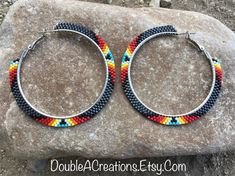 Here's a pair of Gunmetal Gray with Native Colors 2 inch beaded hoop earrings.  They would be a great addition to your wardrobe. Very lightweight. Handmade is from the Heart ❤️ Handmade in Arizona 🇺🇸 Thank you for stoping by.  Have a great day. Native Beaded Hoop Earrings, Native Hoop Earrings, Native American Beaded Hoop Earrings, Brick Stitch Hoop Earrings, Beaded Hoop Earrings Native American, Seed Bead Hoop Earrings, Beautiful Beaded Earring, Beaded Fashion, Beaded Jewelry Earrings