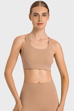 Highly Stretchy Cutout Racerback Sports Bra Solid Nylon Sports Bra With Built-in Bra, High Stretch Activewear With Built-in Bra And Scoop Neck, Fitted Full Coverage Sports Bra With Built-in Padding, Fitted Racerback Bra With Built-in Padding, Fitted Scoop Neck Tank Top With Built-in Padding, Scoop Neck Sports Bra With Built-in Bra For Training, Fitted Activewear With Built-in Padding And Tank Straps, Fitted Sports Bra With Built-in Bra For Gym, Nylon Tank Top With Built-in Bra For Training