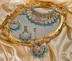 This elegant and gorgeous choker with matching earrings and tikka is sure to be a hit for any event! The neutral colors can match any outfit and the colors are perfect for any occasion! It comes beautiful tones with a pastel finish. The colors are versatile and can pair with any outfit and it's a complete set that can be work with/without the necklace! The mirror work jewelry is extremely popular right now and is a complete statement look. Luxury Elegant Jewelry With Mirror Work, Luxury Elegant Earrings With Mirror Work, Luxury Mirror Work Jewelry For Festivals, Luxury Mirror Work Necklace For Festivals, Traditional Wedding Choker With Mirror Work, Luxury Multicolor Bollywood Jewelry Sets, Traditional Hand-set Choker Jewelry Sets, Meenakari Choker Jewelry Sets For Festivals, Meenakari Choker Jewelry Sets For Gifts