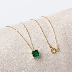 "A stone of inspiration and endless patience, emerald represents unity, compassion and unconditional love. Our single diamond squar emerald necklace is a jewel that you can use daily and on special occasions with its minimalist design. It is a nice gift for yourself and your loved ones. Our necklace will add novelty and elegance to your style. The birthstone of those born in May is emerald. 🔸🔸 Our elegant, style and stylish products suitable for special occasions and daily use are produced wit Square Emerald Necklace, Fine Jewelry Emerald Necklace With Square Pendant, Gift Yellow Gold Emerald Necklace With Cubic Zirconia, Yellow Gold Emerald Necklace With Cubic Zirconia For Gift, Yellow Gold Cubic Zirconia Emerald Necklace For Gift, Square Pendant Emerald Necklace Fine Jewelry For Gift, Gift Cubic Zirconia Emerald Necklace, Emerald Cubic Zirconia Necklace As A Gift, Rectangular Emerald Necklace Fine Jewelry Gift