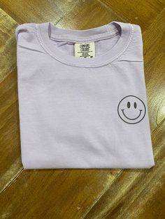 Kids Smiley Face Tshirt Front design  Kids Skate Crew Tshirt Which Crew Are You? MADE TO ORDER This specific color is Orchard This item is made on a custom colors tshirt 5.4 oz., 100% ringspun cotton Ribbed collar with double-needle topstitched neckline Double-needle stitched sleeves and bottom hem Preshrunk, soft-washed, garment-dyed fabric Taped shoulder-to-shoulder Set-in sleeves *Please message me if your interested in any other color* Playful White T-shirt With Smiley Face, Fun Purple T-shirt With Funny Print, Fun Cotton T-shirt With Smiley Face, Playful White Top With Smiley Face, Fun Streetwear T-shirt With Custom Print, Fun Custom Print T-shirt For Streetwear, White Playful T-shirt With Smiley Face, White Smiley Face T-shirt, Fun Everyday T-shirt