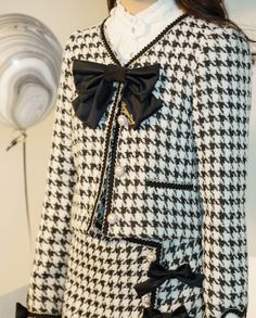 Features: It features v-neck with bowknot front, long sleeves, heart-shaped patches on the cuffs, placket with four pearl buttons, short jacket. High waist, A-line short skirt.  Attention: This price includes a jacket or a skirt only, others are not included.   Size Chart of Jacket:  Size (CM): Unit CM; Sizes below are measured in flat-laid position, hand measurement will have discrepancy of about 2 CM.   	 		 			Size(cm) 			S 			M 			L 			XL 			XXL 		 		 			Bust 			90 			94 			98 			106 			110 Elegant Long Sleeve Outerwear With Bow, Fall Party Outerwear With Bow, Elegant Bow Outerwear For Spring, Elegant Spring Outerwear With Bow, Lover Black And White, Skirt Straight, Checkered Jacket, Elegant Jacket, Plaid Ribbon