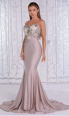 Promote attention-grabbing style in this stunning PAS PS21243. Shine and sizzle in this strapless evening dress that presents in sweetheart neckline on a fitted bodice. It is designed with floral embroidery on top and has a shiny fabric used all-over. It has mid-back cut and back zipper closure, the body-tight dress is flared on the trumpet silhouette and has a wonderful sweep train finish. Experience the outstanding effect in this dress by PAS. #elegantdresses #designergown #couturedress Long Floral Dresses, Two Piece Gown, Strapless Evening Dress, Shiny Fabric, Strapless Gown