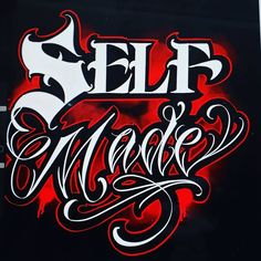 the word self made written in black and red ink