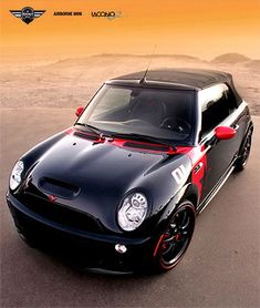 a black and red sports car parked in the desert