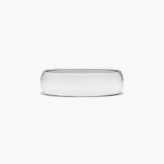 a white gold wedding ring on a white background