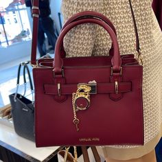 Michael Kors Hamilton Small Satchel Shoulder Crossbody Bag Dark Cherry Color Pebbled Leather Michael Kors Logo At Front Zip Top Closure Gold Toned Hardware Mk Key & Lock On Front Custom Mk Fabric Lining 1 Slip-In Pockets 1 Zipper Pocket 10" (L) X 8"(H) X 4"(D) Strap: 4", 18"- 24" Very Clean, Smoke-Free And Pet-Free Environment Dark Cherry Color, Cherry Color, Brown Leather Satchel, Michael Kors Satchel, Michael Kors Logo, Black Leather Satchel, Bag Dark, Cute Handbags, Leather Satchel Bag