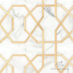 a marble wall with gold geometric designs on it