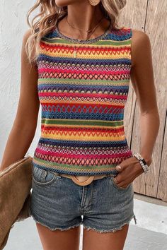 Embrace sunny days in this top, exuding bohemian charm with its vibrant hue and intricate design.The sleeveless style offers freedom of movement, perfect for casual outings or layering under a jacket for a versatile look.Featuring a round neck, this top provides a classic silhouette that is easy to style up or down for various occasions.The ethnic wavy pattern adds a unique touch, making this top a standout piece in any wardrobe.Designed for comfort and style, this tank top is a must-have for th Trendy Multicolor Sleeveless Tops, Multicolor Fitted Casual Vest, Fitted Multicolor Casual Vest, Casual Fitted Multicolor Vest, Multicolor Sleeveless Blouse Tank Top For Day Out, Spring Multicolor Stretch Vest, Colorful Hippie Tops For Spring, Multicolor Sleeveless Tank Top For Day Out, Multicolor Stretch Sleeveless Tops