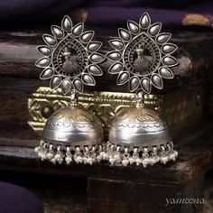 Enhance your look with Mayura jumkis, featuring an elegant oxidized finish complemented by rich 22kt gold plating. These earrings merge classic charm with a contemporary edge, offering a sophisticated accessory that stands out with every wear. Elegant Oxidized Chandbalis For Festivals, Traditional Metal Danglers For Formal Occasions, Fusion Style Chandbali Brass Jhumkas, Elegant Oxidized Chandbali Jhumkas, Fusion Style Oxidized Jhumkas For Diwali, Elegant Oxidized Finish Chandbalis For Festive Occasions, Elegant Oxidized Chandbalis For Festive Occasions, Traditional Oxidized Finish Earrings For Formal Occasions, Diwali Fusion Oxidized Jhumkas