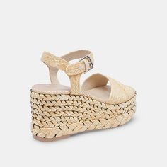 When recycled materials meet this season's raffia trend, only good things result. Meet TIAGO: a vacay-to-event sandal that's quickly become one of our favorites. Pair her with spring midi dresses, airy tailored trousers, or anything in between. Raffia Upper Recycled Synthetic Outsole Water-based Leather Alternative Lining Water-based Leather Alternative Sock 3.4" Heel Height 1.8" Platform Height Imported Spring Midi Dress, Dolce Vita Sandals, Raffia Sandals, Womens Sandals Summer, Shades Of Beige, Designer Sandals, Flat Sneakers, Shoe Lover, Tailored Trousers