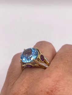 Vintage cocktail ring. Huge great color blue topaz stone  surrounding  setting is handcrafted in 925 sterling silver  Size  6.5 Can be sized, my jeweler charges $20  All rings are shipped free in the US in a nice gift box.   Check out our over a THOUSAND great reviews Engraving is $4 per letter and is not always perfect depending on the piece. It can take a few days if the jeweler is busy. This is payable to Paypal Judithsltd@gmail.com  PLEASE NOTE If we have multiples of the same vintage item, Luxury Blue Amethyst Ring, Luxury Birthstone Ring With Gemstone Accents, Fine Jewelry Multi-stone Blue Topaz Ring, Elegant Multi-stone Aquamarine Ring, Multi-stone Blue Topaz Ring For Formal Occasions, Luxury Round Topaz Gemstone Ring, Blue Topaz Multi-stone Ring For Formal Occasions, Unique Multi-stone Blue Topaz Ring, Elegant Multi-stone Blue Topaz Rings