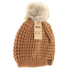 We are loving this elegant waffle stitched pattern on this solid beanie. We added the best-selling natural faux fur pom to top it off. It is available in a variety of classic and earth tone colors to fit every person's fancy! C C Logo, Steve Madden Mules, Faux Fur Top, Eyewear Kids, Fur Top, Cc Beanie, Waffle Stitch, Earth Tone Colors, Beanie Style