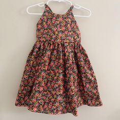 Ready to ship! Size 3T tie-back dress in a whimsical Rifle Paper Co hot pink and metallic gold floral rosa print on a burgundy background. Featuring an adorable adjustable tie back, high neckline, and elastic back waist. Hits knee length and fits true to size. Full gathered skirt for maximum twirl potential. Stay cool all summer, then layer over long sleeves or with tights and a sweater for fall! Handmade in Michigan from 100% cotton. Cute Floral Print Sundress For Dress-up, Pink Fitted Tie-back Sundress, Pink Fitted Sundress With Tie Back, Fitted Pink Sundress With Tie Back, Pink Tie-back Sundress For Garden Party, Summer Floral Print Dress For Dress-up, Pink Tie Back Sundress For Garden Party, Floral Print Dress For Summer Dress-up, Pink Cotton Sundress