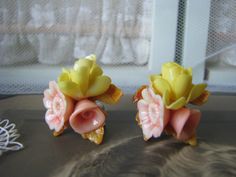 A lovely pair of vintage 1950's realistic celluloid floral screw back earrings. Each earring measures 1 1/8'' x 1 1/8''. In good vintage condition. Vintage Flower Clip-on Earrings For Wedding, Vintage Yellow Flower Earrings, Vintage Celluloid, Earrings Wedding, Screw Back Earrings, Wedding Earrings, Flower Earrings, Vintage 1950s, Clip On Earrings