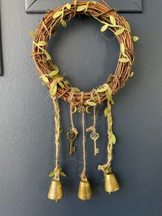 a wreath with bells hanging on the wall