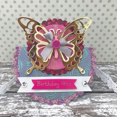 a birthday card with a butterfly on it and a ribbon around the edge that says, happy birthday girl