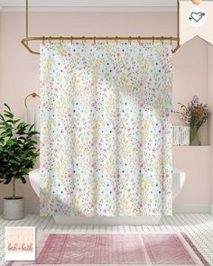 a bathroom with a pink rug and shower curtain in front of the bathtub is shown